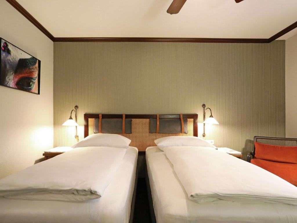 Postel nebo postele na pokoji v ubytování Mercure Hotel Frankfurt Airport Langen