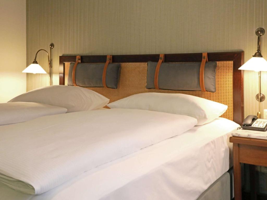Postel nebo postele na pokoji v ubytování Mercure Hotel Frankfurt Airport Langen