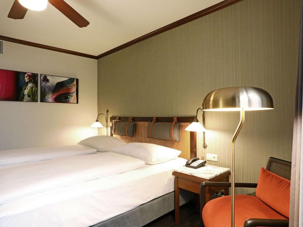 Postel nebo postele na pokoji v ubytování Mercure Hotel Frankfurt Airport Langen