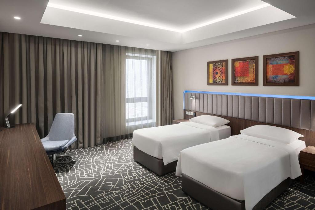 Postel nebo postele na pokoji v ubytování Park Inn by Radisson Makkah Aziziyah