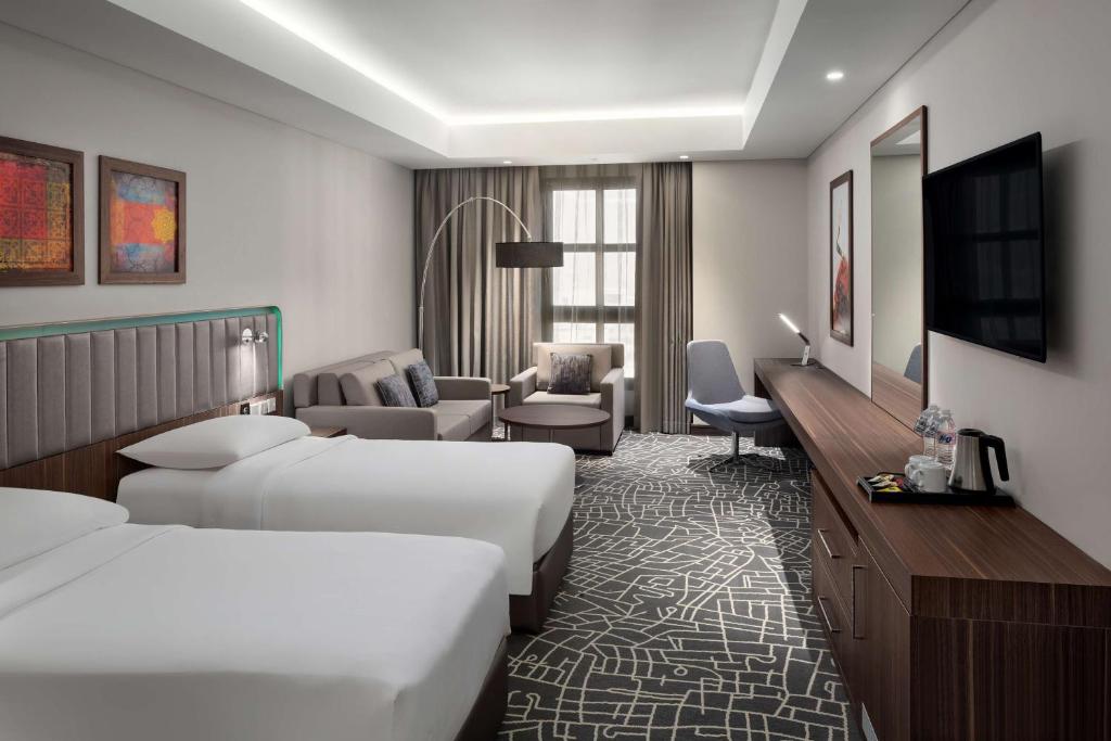 Postel nebo postele na pokoji v ubytování Park Inn by Radisson Makkah Aziziyah