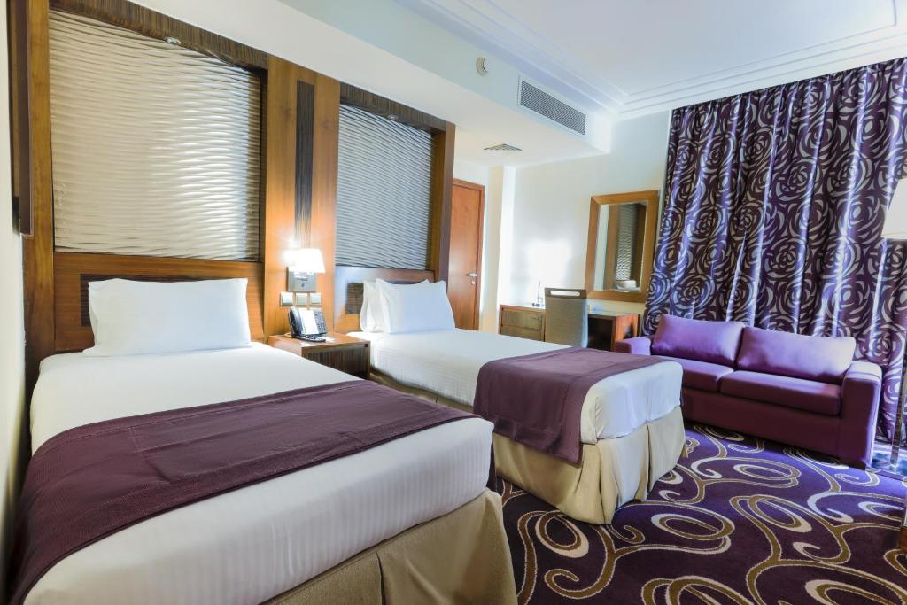 Postel nebo postele na pokoji v ubytování Elaf Kinda Hotel