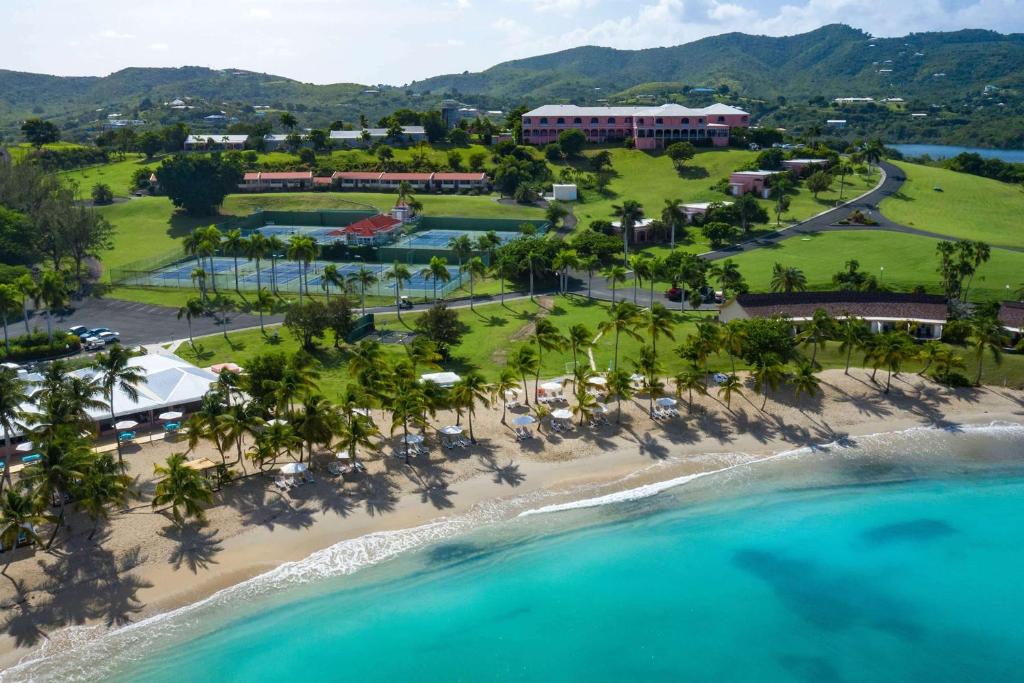 an aerial view of the resort and the beach at The Buccaneer Beach & Golf Resort in Christiansted