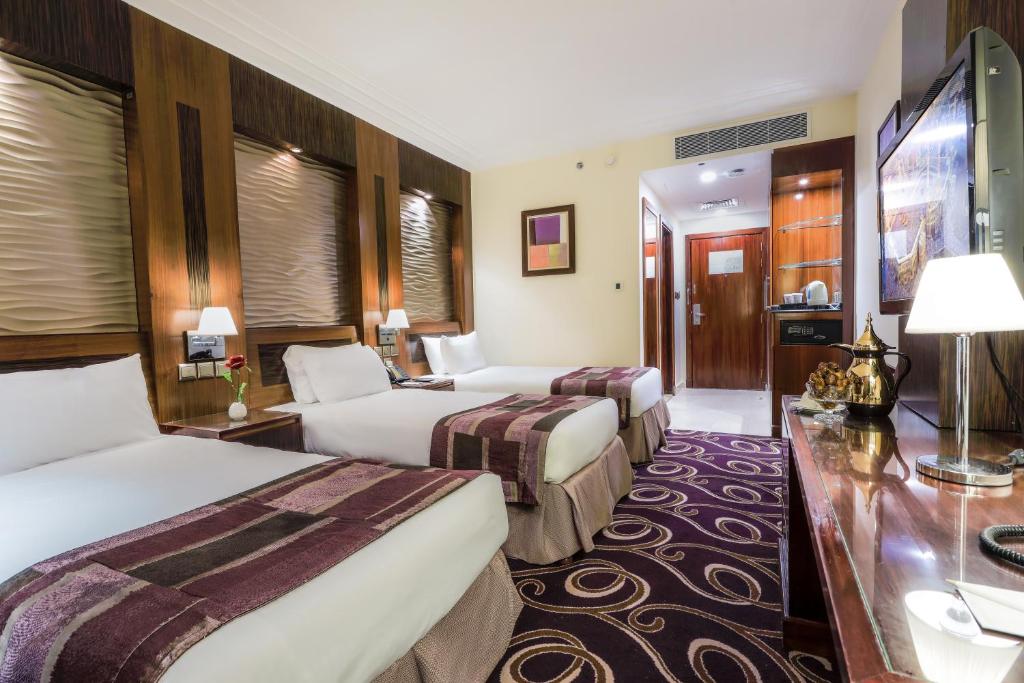 Postel nebo postele na pokoji v ubytování Elaf Kinda Hotel