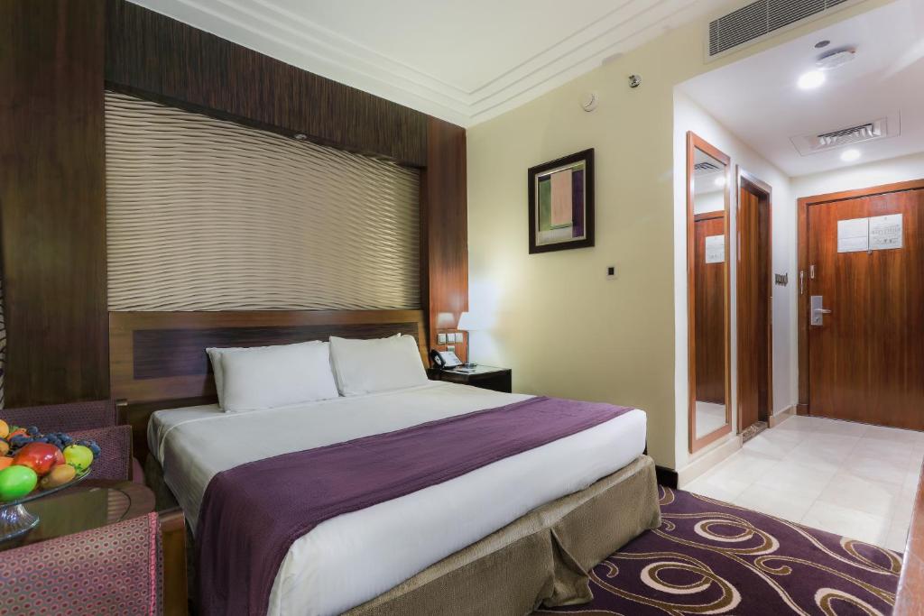 Postel nebo postele na pokoji v ubytování Elaf Kinda Hotel