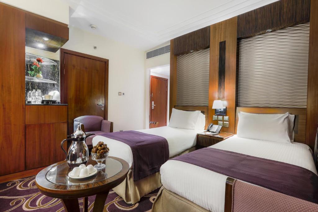 Postel nebo postele na pokoji v ubytování Elaf Kinda Hotel