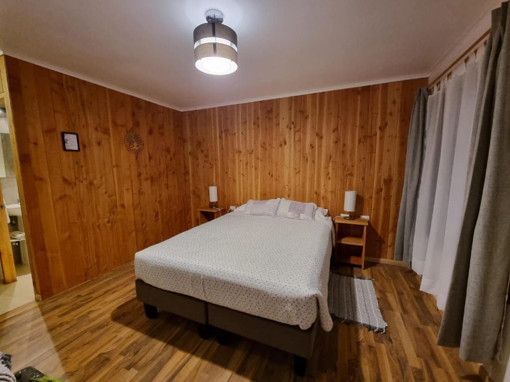 Postel nebo postele na pokoji v ubytování Apart Hotel Antu de Villarrica