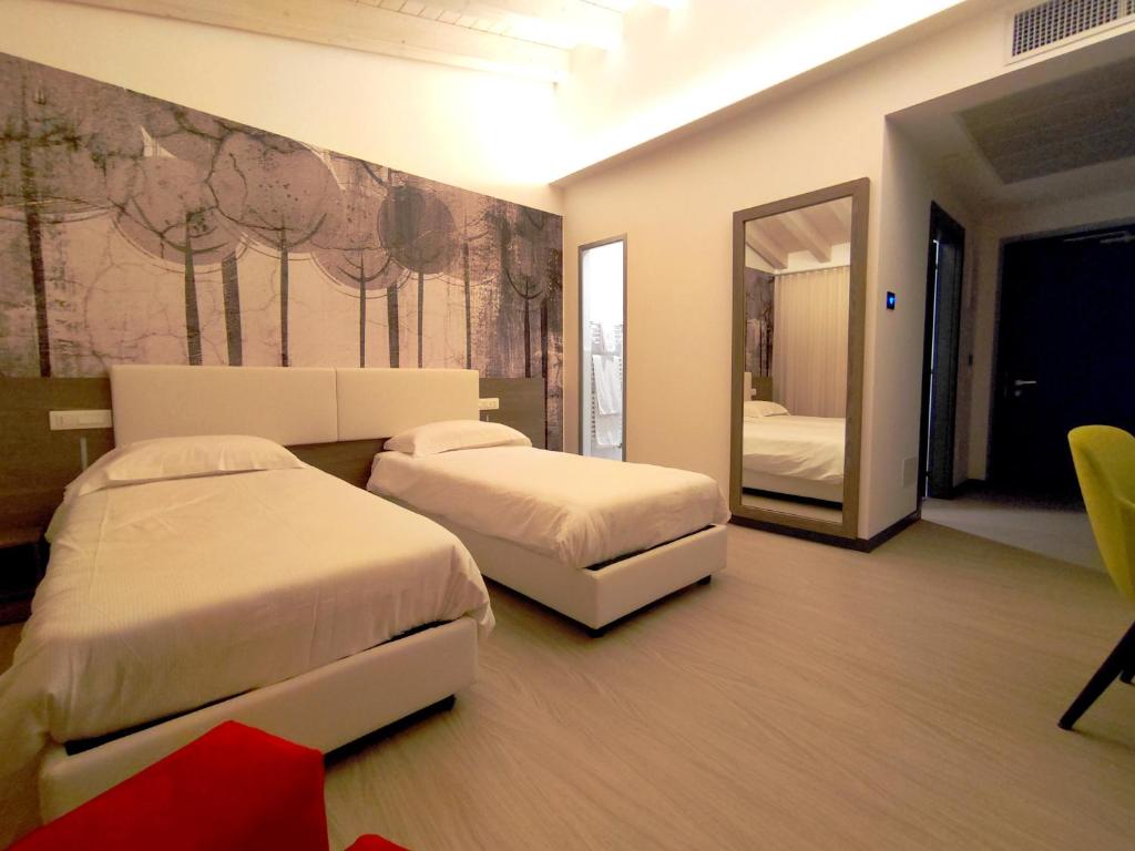Posteľ alebo postele v izbe v ubytovaní Hotel Luna
