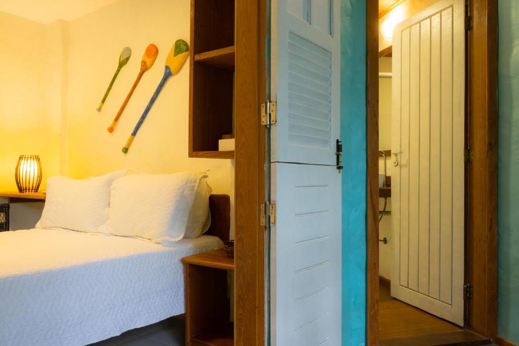 Uma cama ou camas num quarto em Atmosphera Pousada
