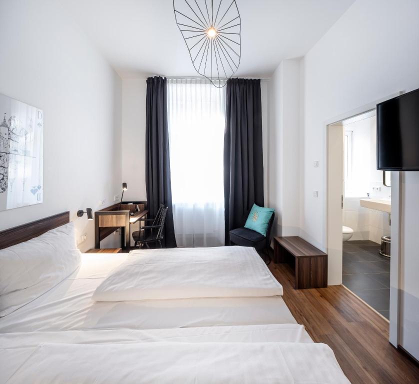 Postel nebo postele na pokoji v ubytování acor Boutique Hotel