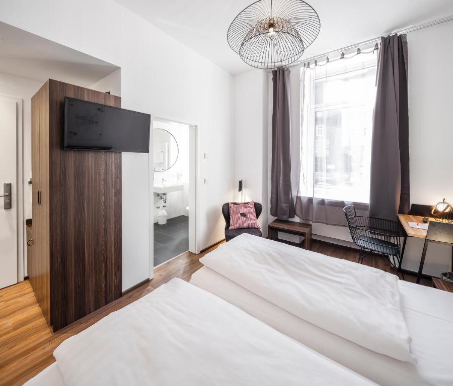 Postel nebo postele na pokoji v ubytování acor Boutique Hotel