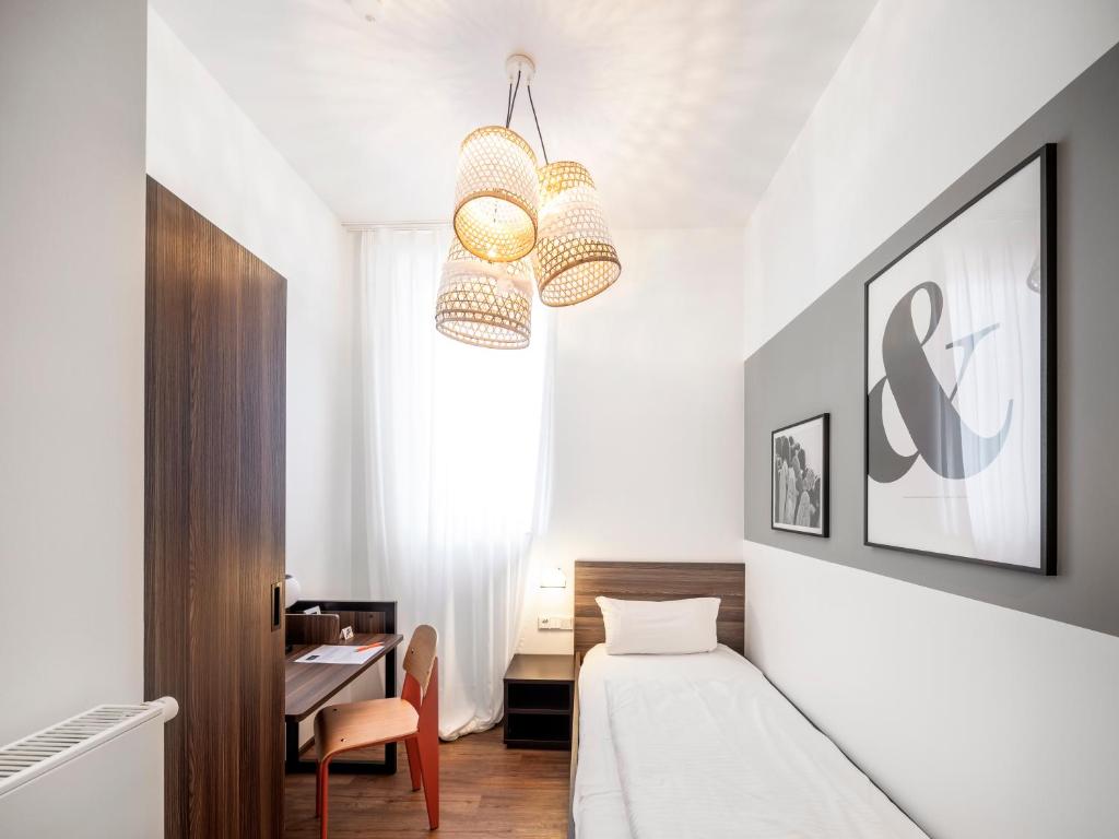 Postel nebo postele na pokoji v ubytování acor Boutique Hotel