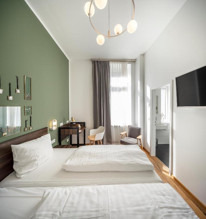 Postel nebo postele na pokoji v ubytování acor Boutique Hotel
