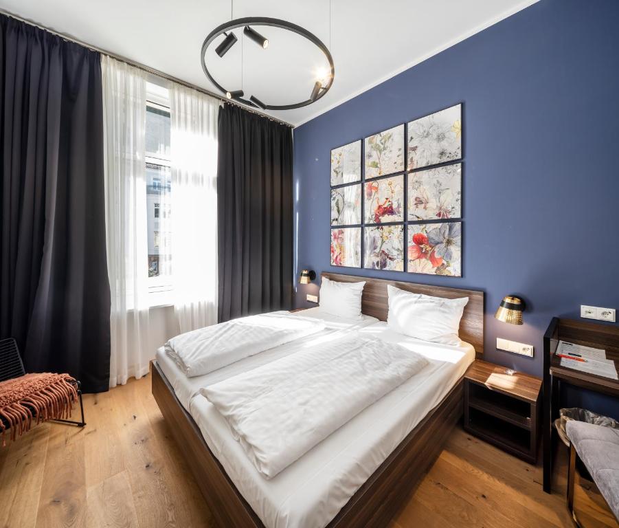 Postel nebo postele na pokoji v ubytování acor Boutique Hotel