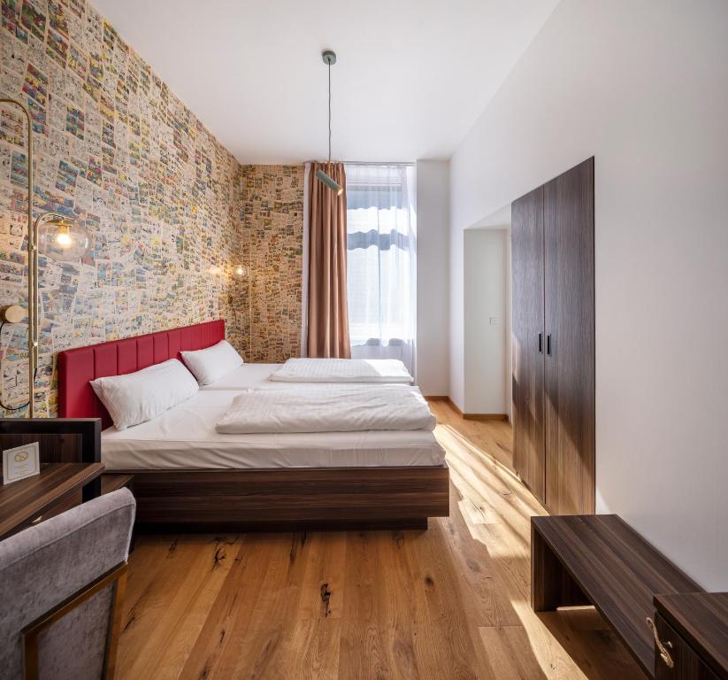 Postel nebo postele na pokoji v ubytování acor Boutique Hotel