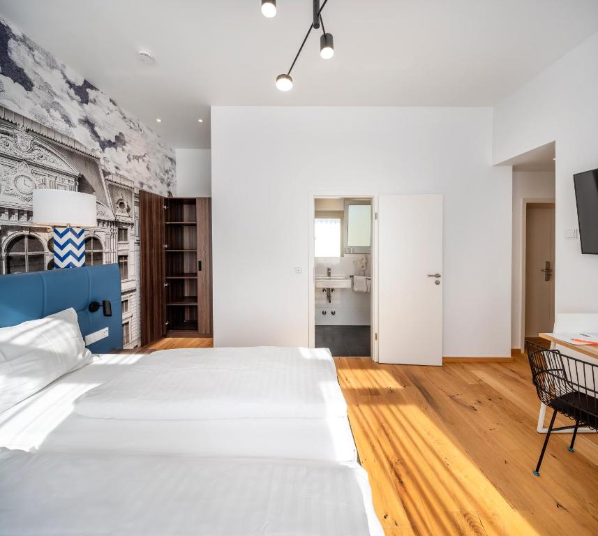 Postel nebo postele na pokoji v ubytování acor Boutique Hotel