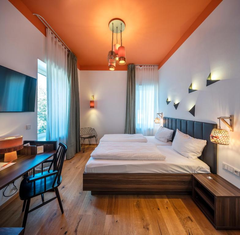 Postel nebo postele na pokoji v ubytování acor Boutique Hotel