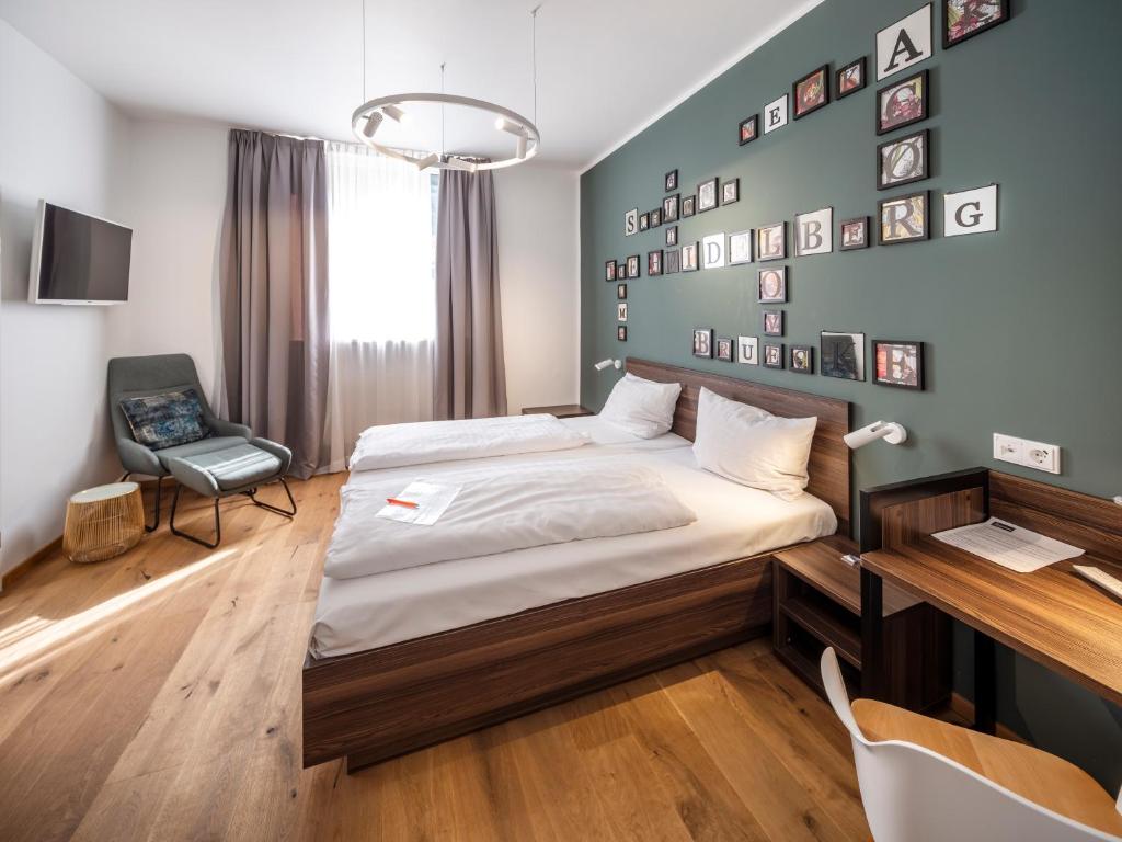 Postel nebo postele na pokoji v ubytování acor Boutique Hotel