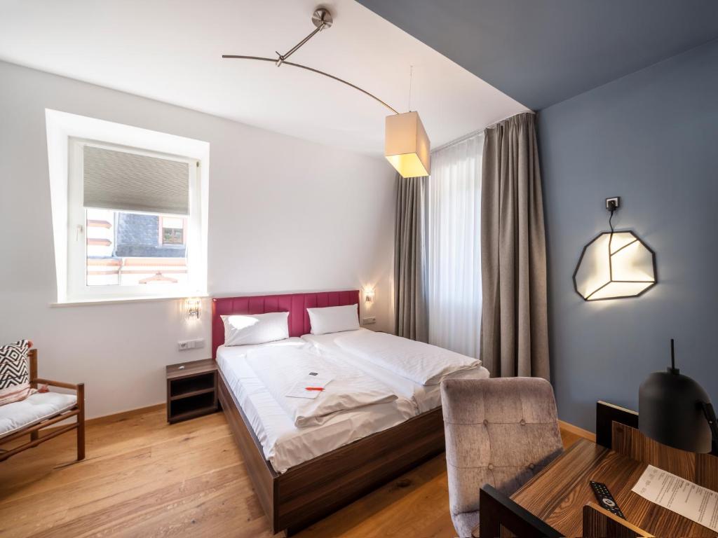 Postel nebo postele na pokoji v ubytování acor Boutique Hotel
