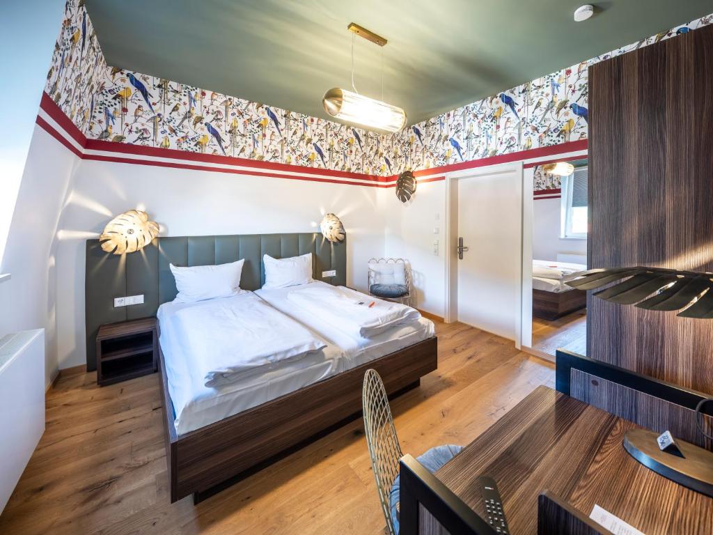 Postel nebo postele na pokoji v ubytování acor Boutique Hotel