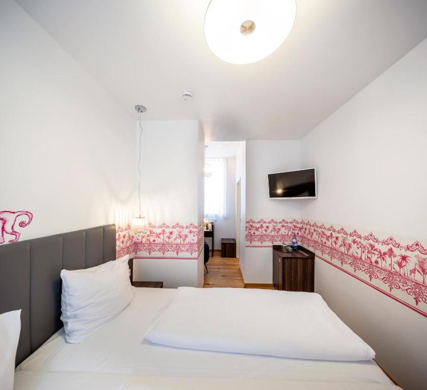 Postel nebo postele na pokoji v ubytování acor Boutique Hotel