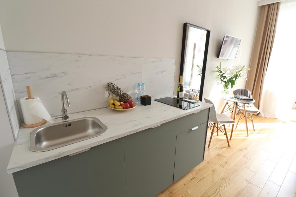 Kuchyňa alebo kuchynka v ubytovaní Apartamenty na Teatralnej 14 - Katowice