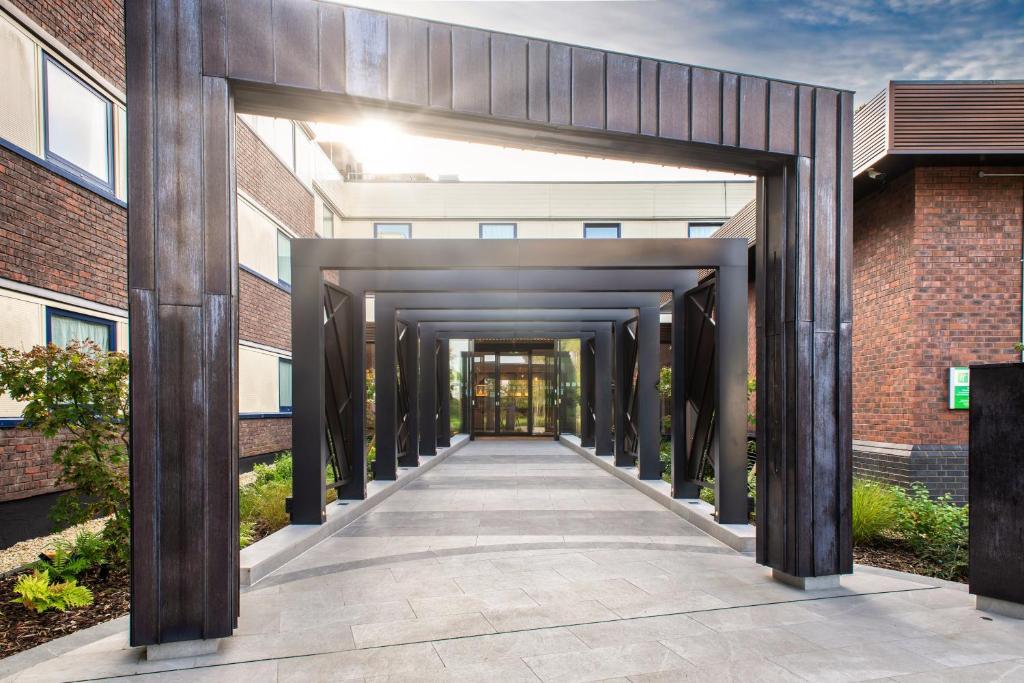 a walkway leading into a building at Holiday Inn London-Shepperton, an IHG Hotel in Shepperton