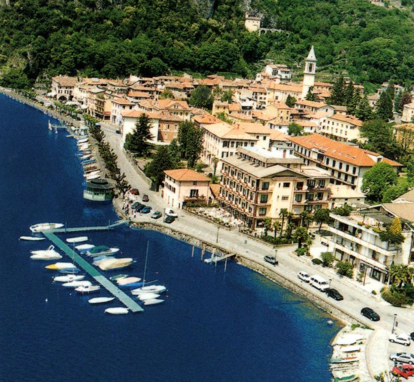 a group of boats are docked in a harbor at Hotel Europa in Porlezza