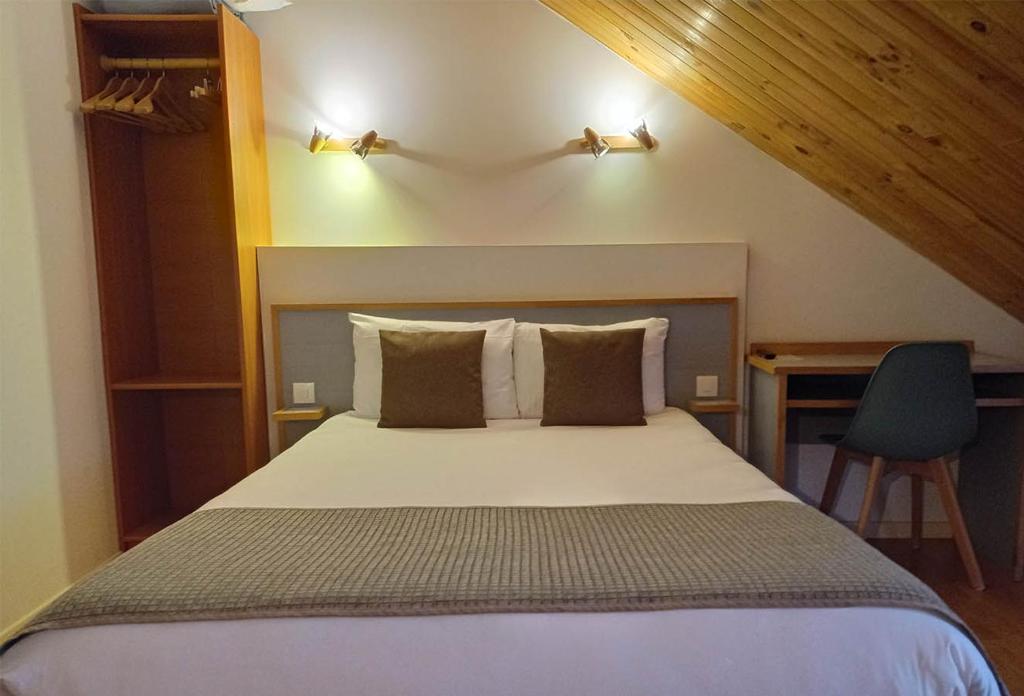 Postel nebo postele na pokoji v ubytování Hôtel de la Gare