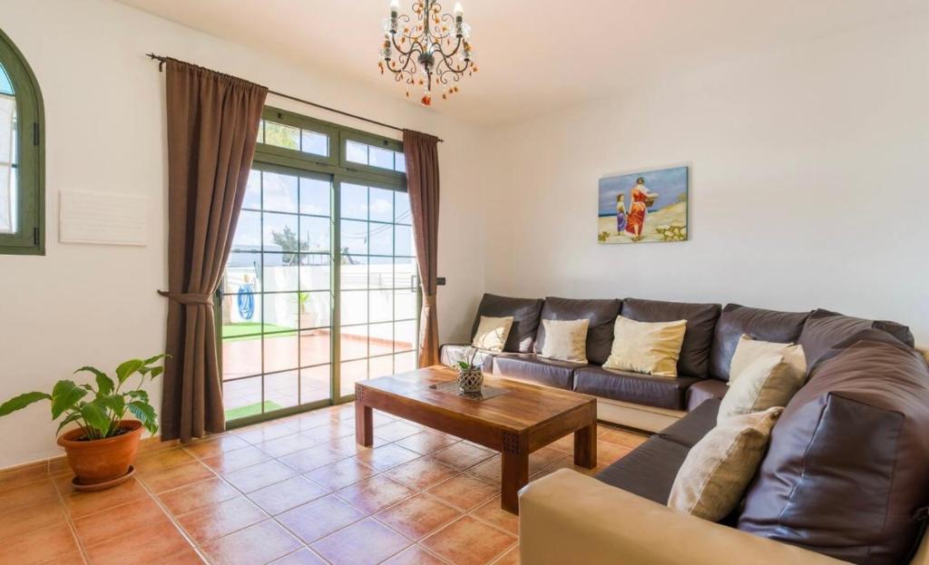 A seating area at Pico Partido villa heated pool