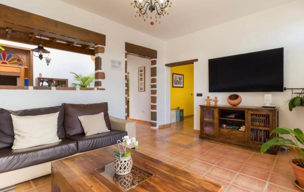 A television and/or entertainment centre at Pico Partido villa heated pool