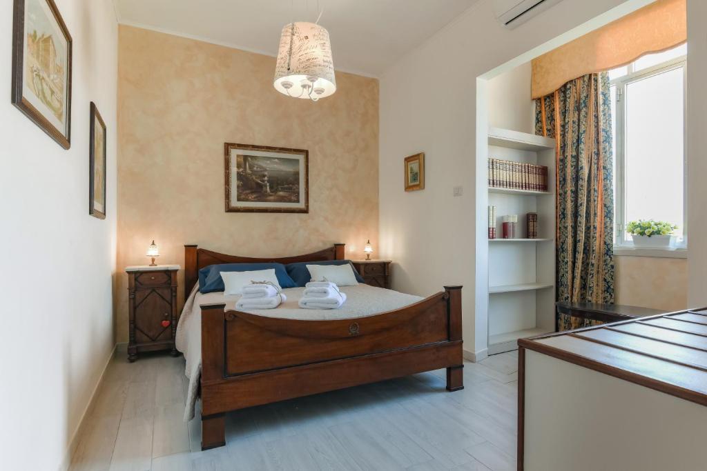 A bed or beds in a room at Alghero Roof Garden