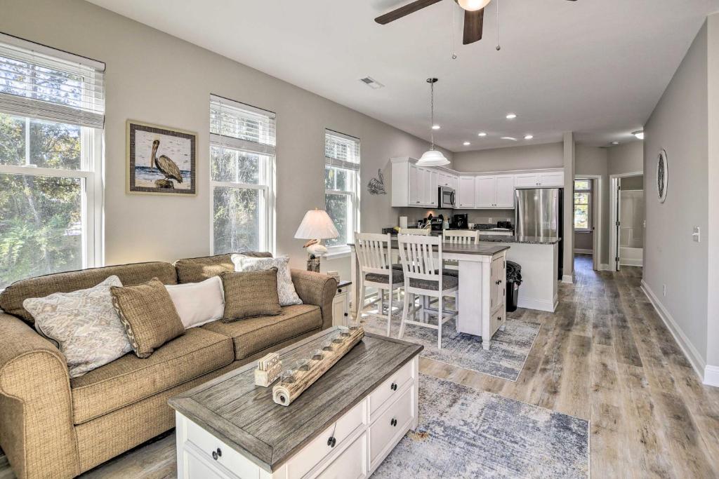 a living room with a couch and a table at Modern Escape in the Heart of Murrells Inlet in Myrtle Beach