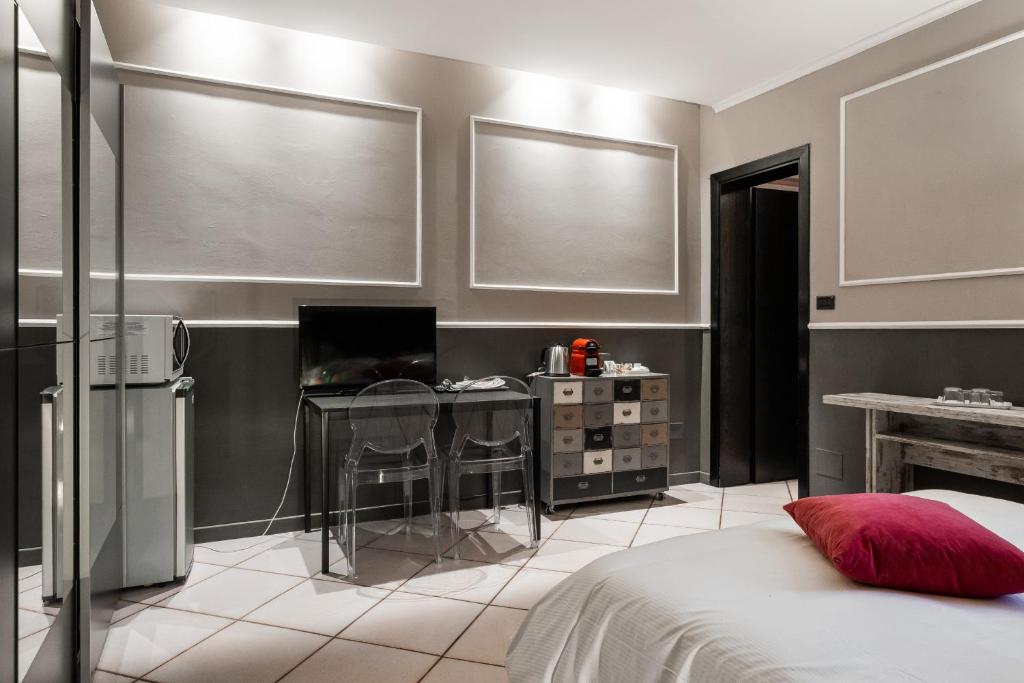 A bed or beds in a room at Studio Fusari a Piazza Maggiore by Wonderful Italy
