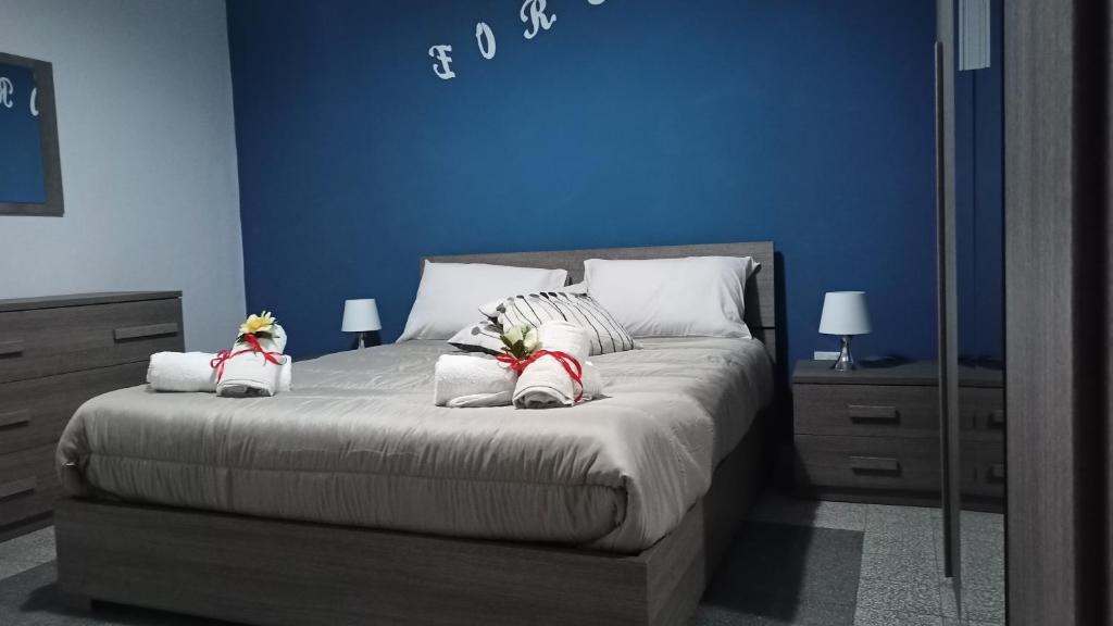 מיטה או מיטות בחדר ב-Appartamento il Borgo di Baroncino