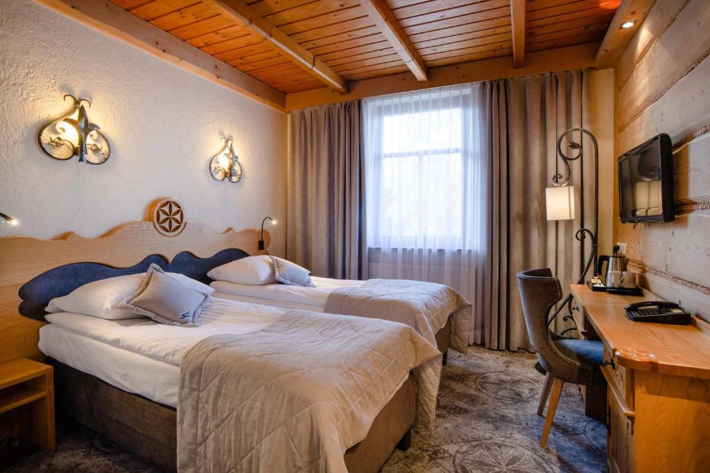 Posteľ alebo postele v izbe v ubytovaní Hotel Sabała