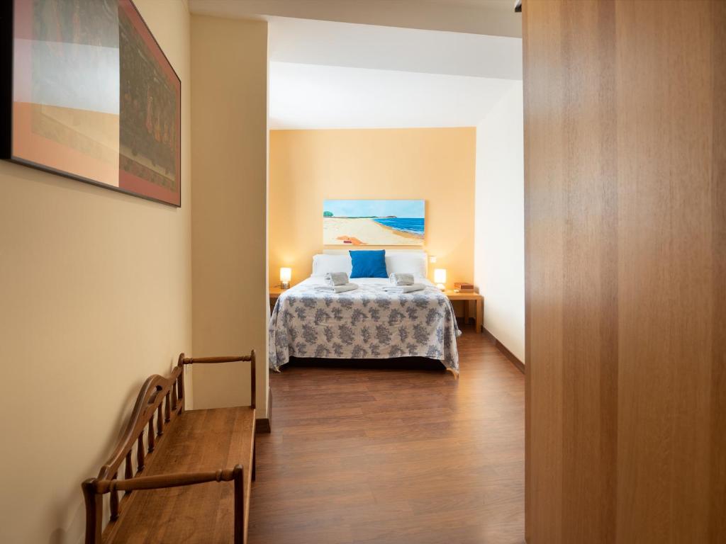 A bed or beds in a room at San Felipe Sevilla Urban Apartment