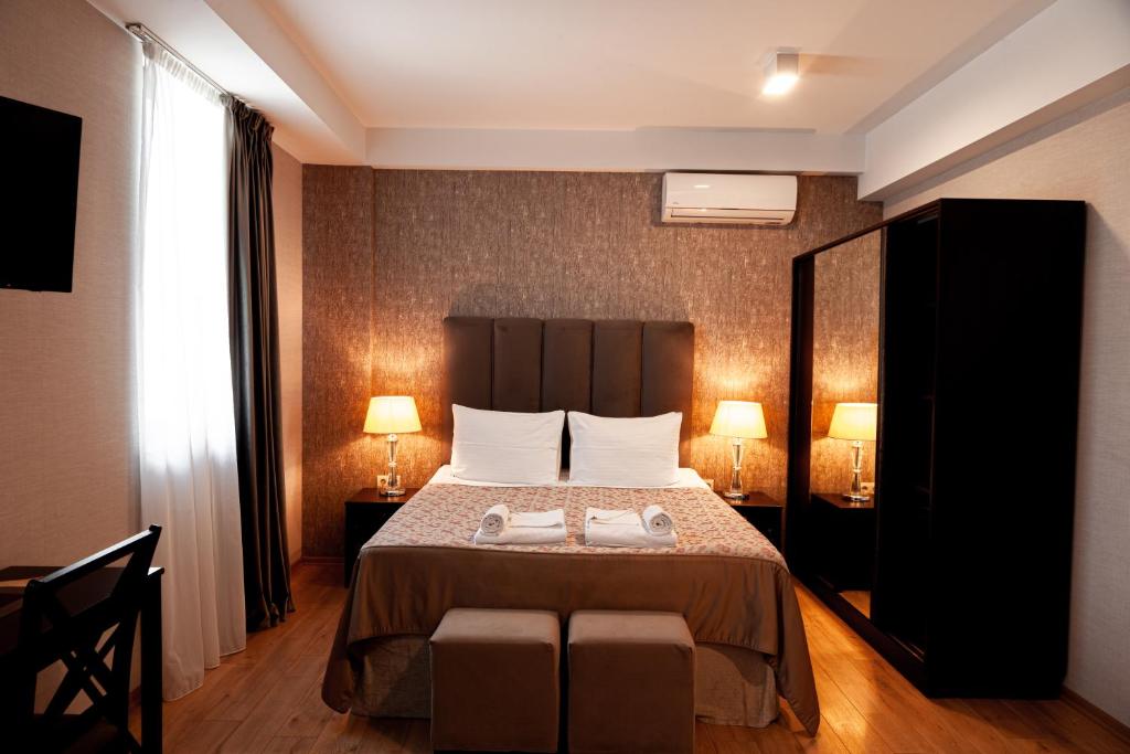 Postel nebo postele na pokoji v ubytování Hotel Winoterra