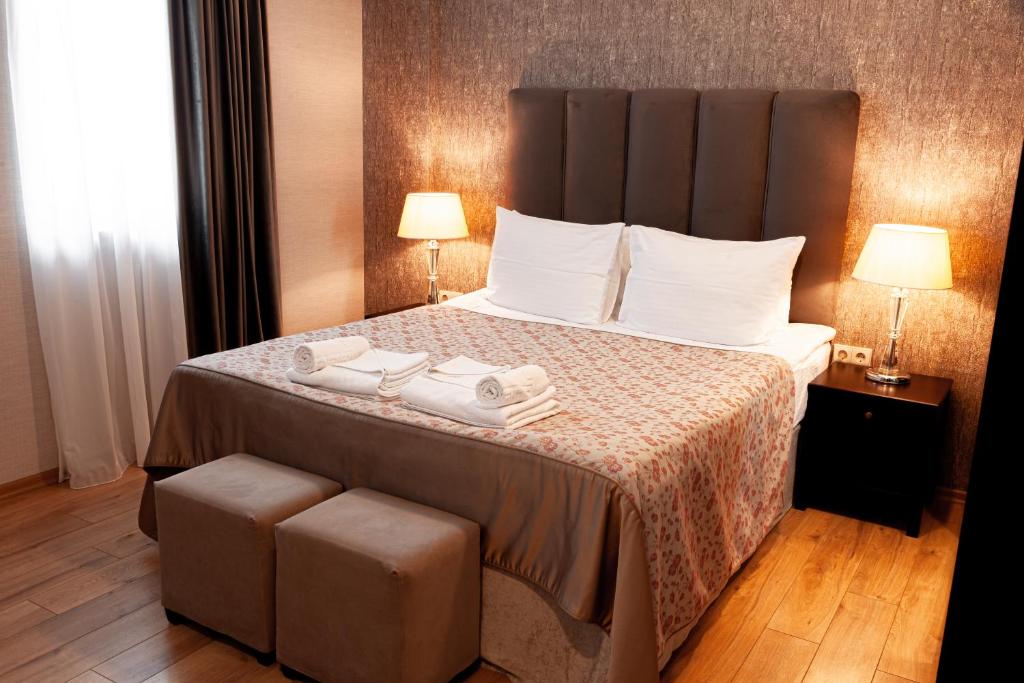 Postel nebo postele na pokoji v ubytování Hotel Winoterra