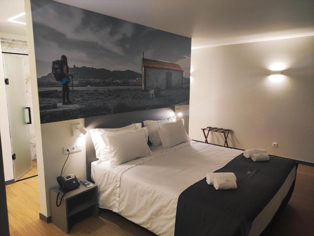 Postel nebo postele na pokoji v ubytování Flag Design Hotel