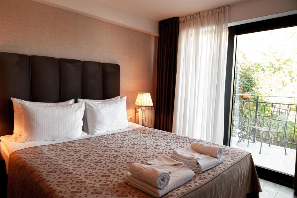 מיטה או מיטות בחדר ב-Hotel Winoterra