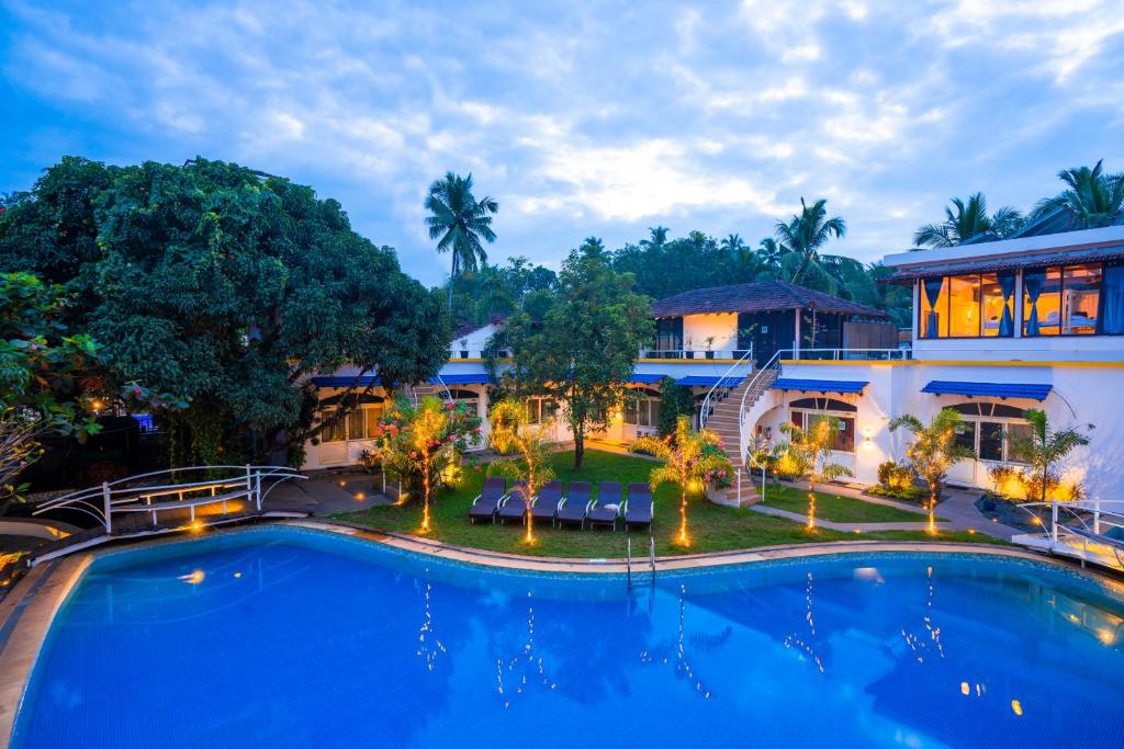 an aerial view of a resort with a large swimming pool at Moustache Goa Luxuria in Vagator