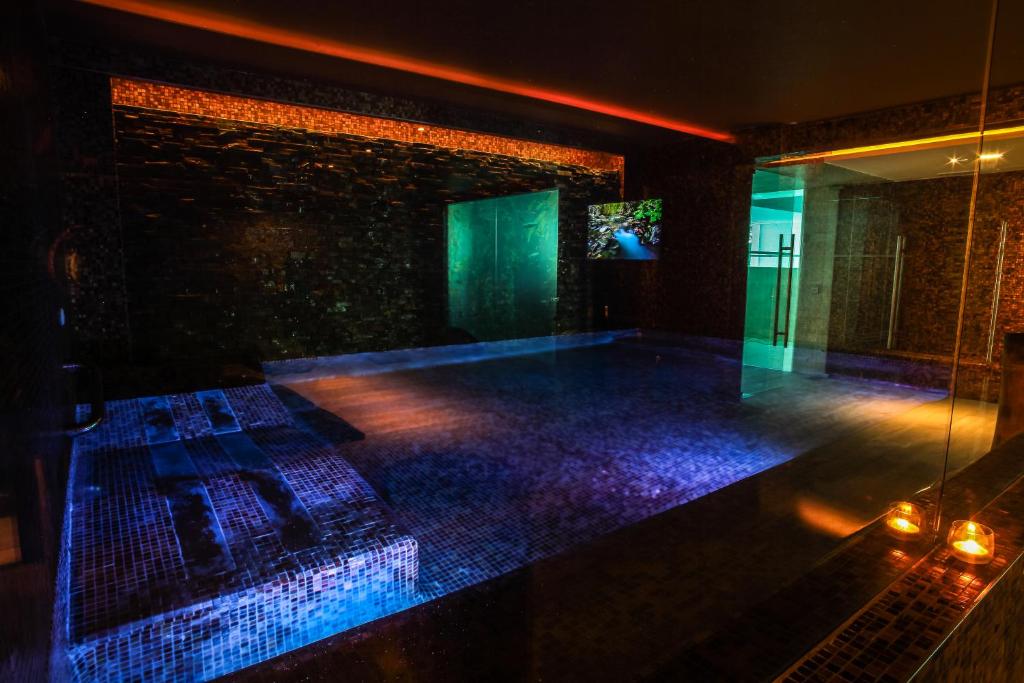 a dance floor with blue lights in a room at Hotel Cascais Miragem Health & Spa in Cascais