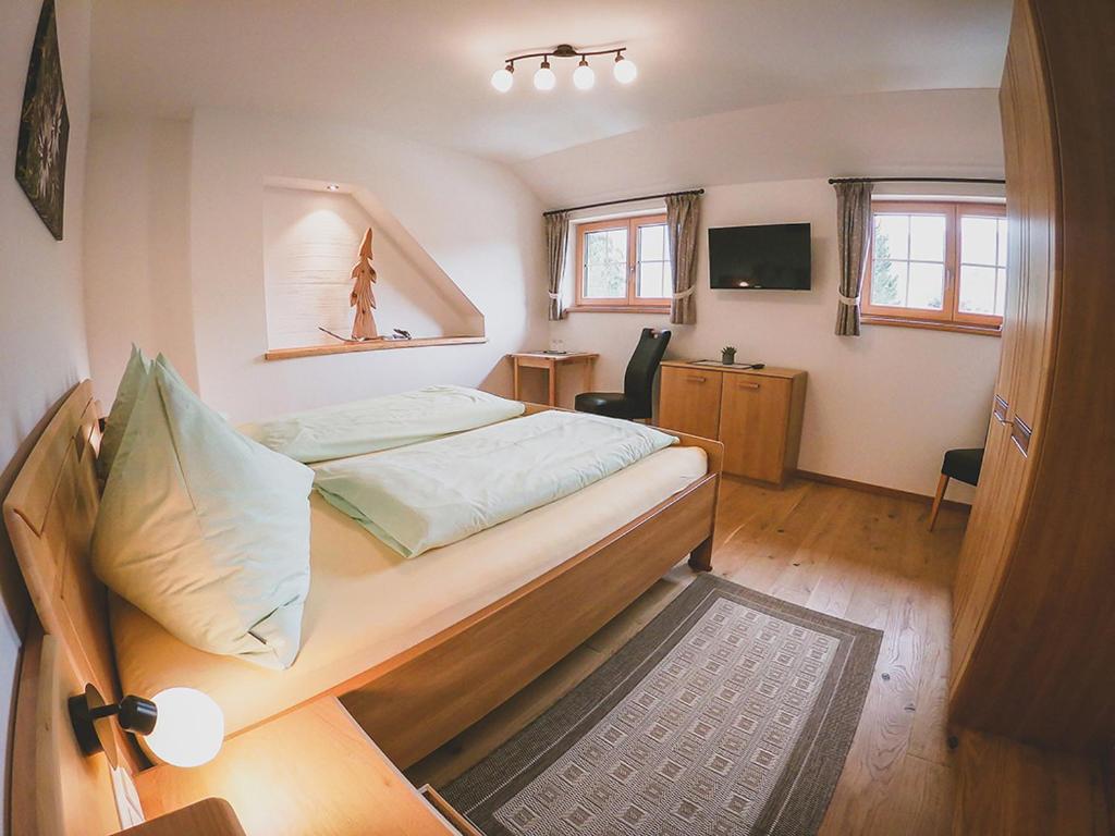 A bed or beds in a room at Appartements Macheiner