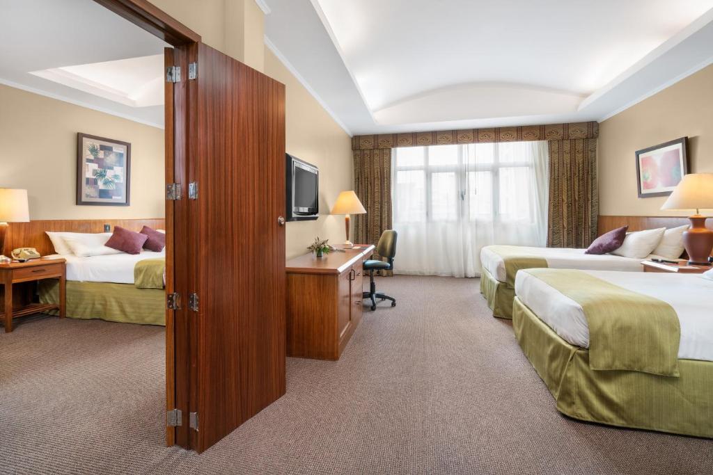 Postel nebo postele na pokoji v ubytování Hotel Palace Guayaquil