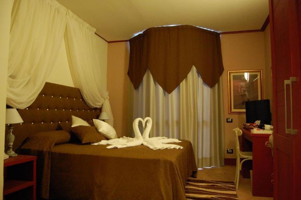Łóżko lub łóżka w pokoju w obiekcie Hotel Antica Tabaccaia Resort