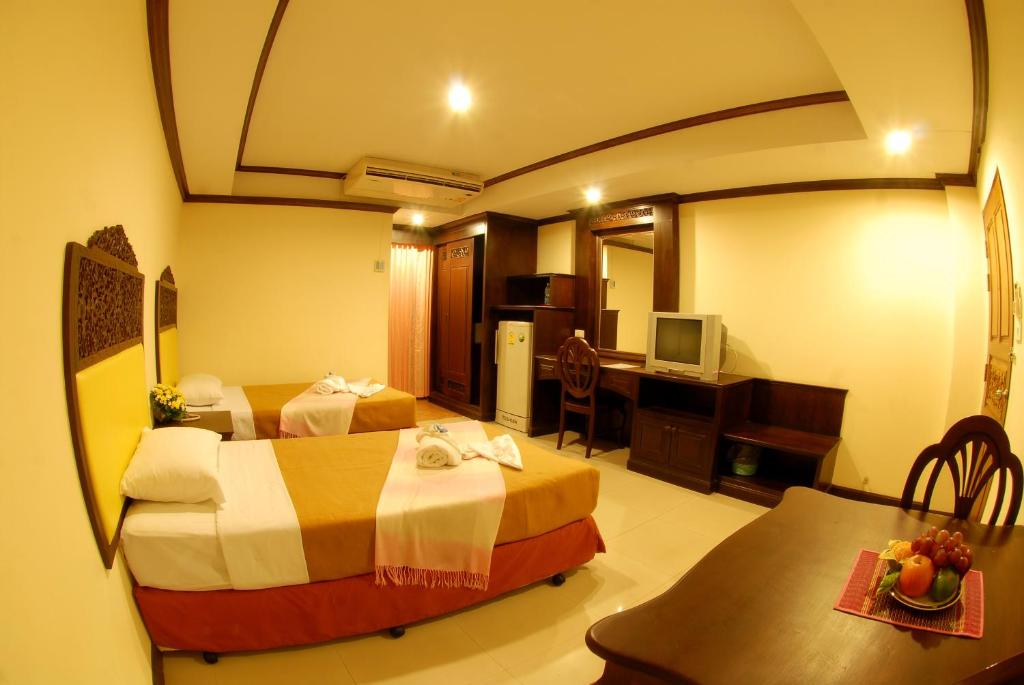 Postel nebo postele na pokoji v ubytování Golden Villa Pattaya