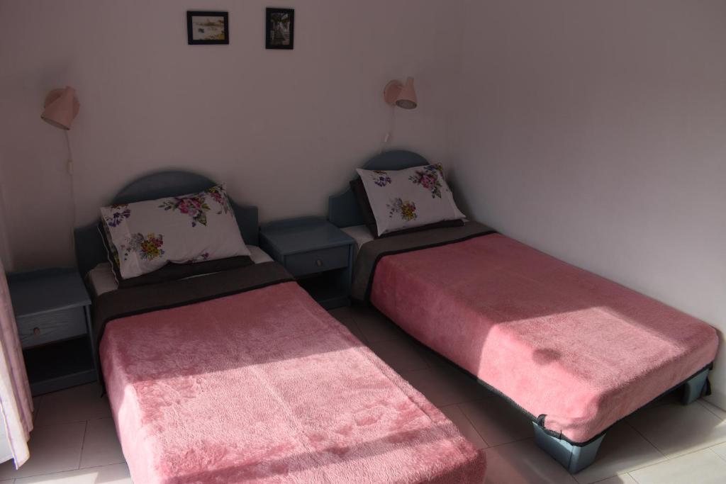 Posteľ alebo postele v izbe v ubytovaní Niki Apartments