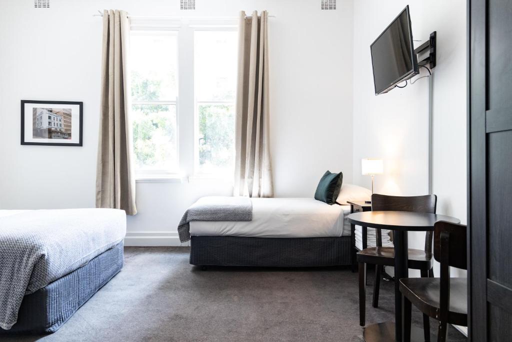 Postel nebo postele na pokoji v ubytování Wynyard Hotel