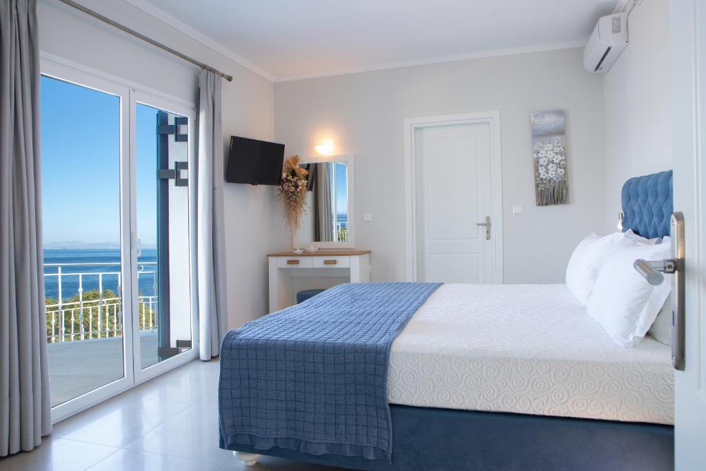 Posteľ alebo postele v izbe v ubytovaní Kavos House